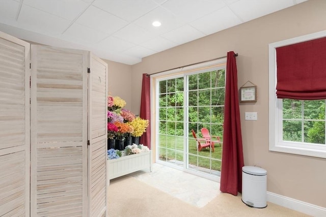 12 Cranberry Ln, Wrentham, MA 02093 - entryway with healthy amount of natural light, carpet, baseboards, and a drop ceiling