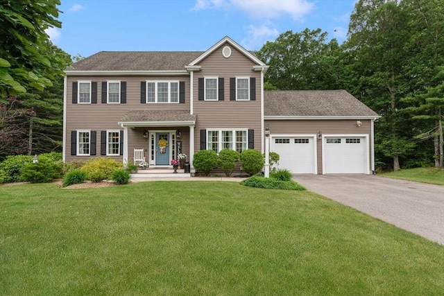 12 Cranberry Ln, Wrentham, MA 02093 - view of front of property with a garage, asphalt driveway, and a front yard