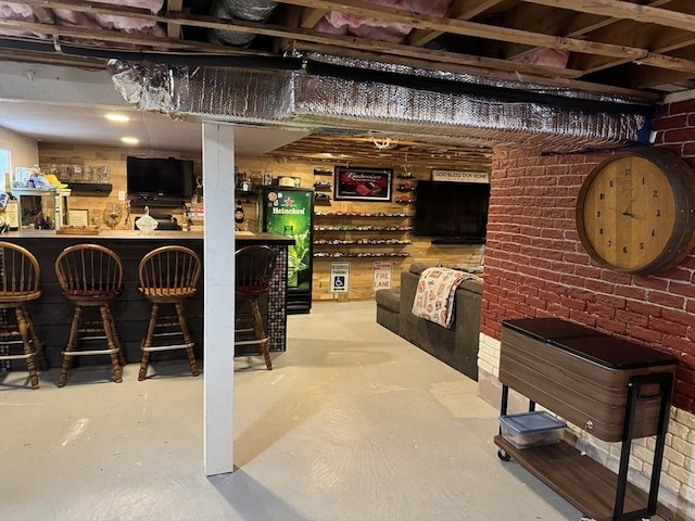 bar with concrete flooring and a dry bar