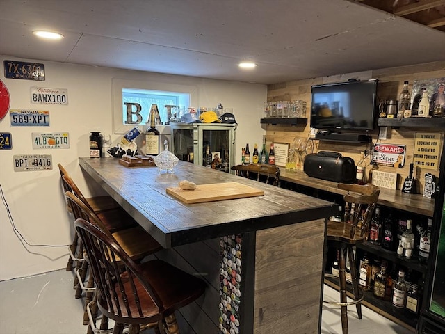 bar with recessed lighting and a bar