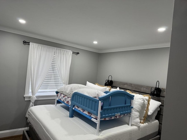 bedroom with ornamental molding and recessed lighting