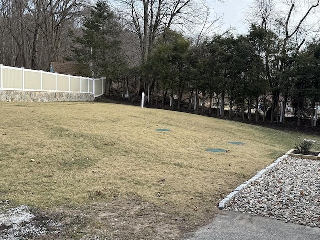 view of yard featuring fence