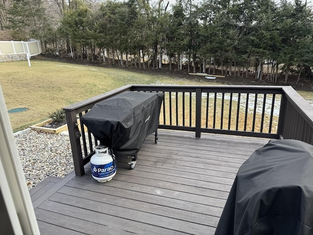 deck with a yard and a grill