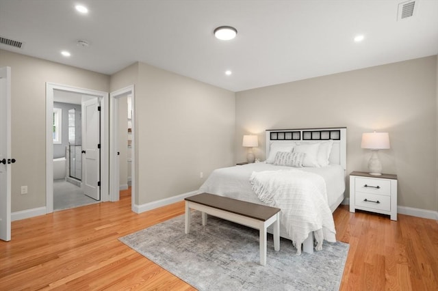 bedroom with baseboards, light wood-style flooring, and recessed lighting