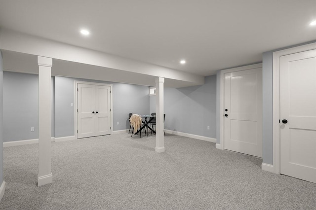 finished below grade area featuring carpet, baseboards, and recessed lighting