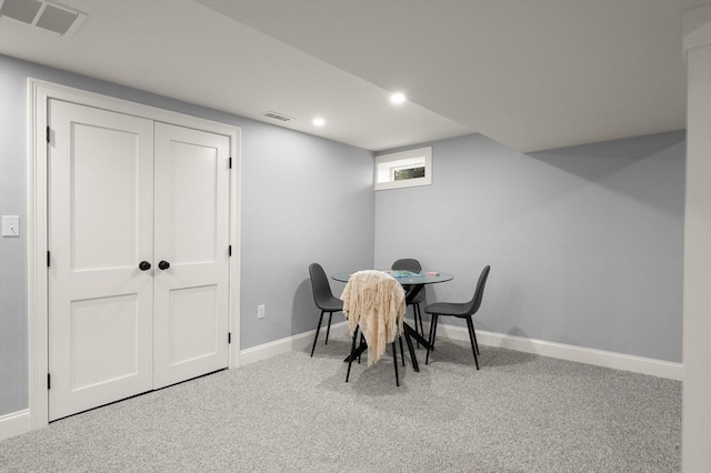carpeted dining area featuring baseboards and recessed lighting
