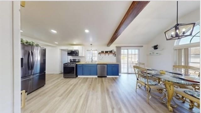 95 Prospect Street Ext, Westfield, MA 01085 - kitchen with stainless steel appliances, blue cabinetry, light wood-style flooring, a chandelier, and light countertops