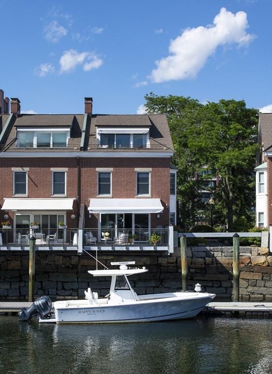 8 Union Wharf Unit 8, Boston, MA 02109 - back of property featuring brick siding, a water view, and a chimney
