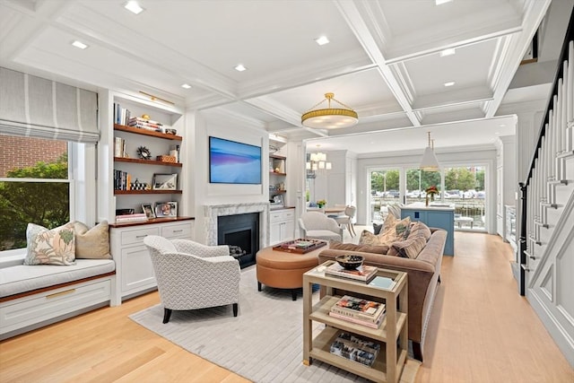 8 Union Wharf Unit 8, Boston, MA 02109 - living area featuring stairs, light wood-style flooring, a fireplace, beamed ceiling, and coffered ceiling