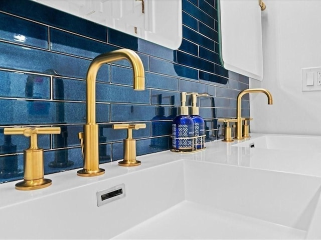 details with tasteful backsplash and a sink