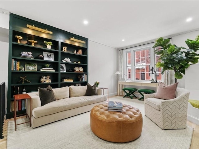 sitting room featuring baseboards and recessed lighting