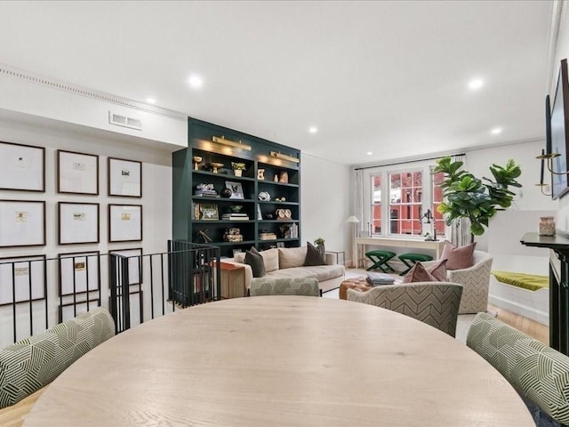 interior space with wood finished floors, visible vents, and recessed lighting