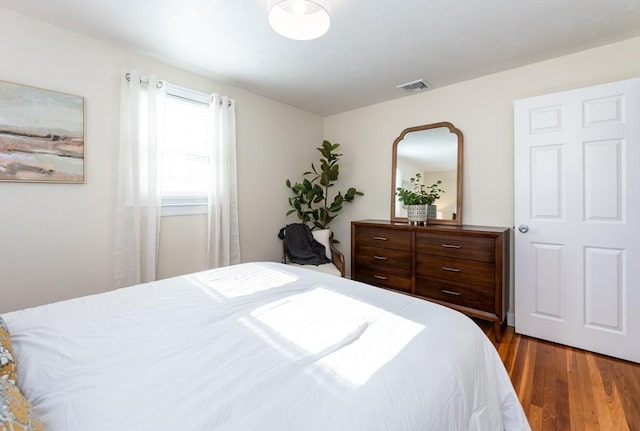 bedroom featuring dark wood-type flooring