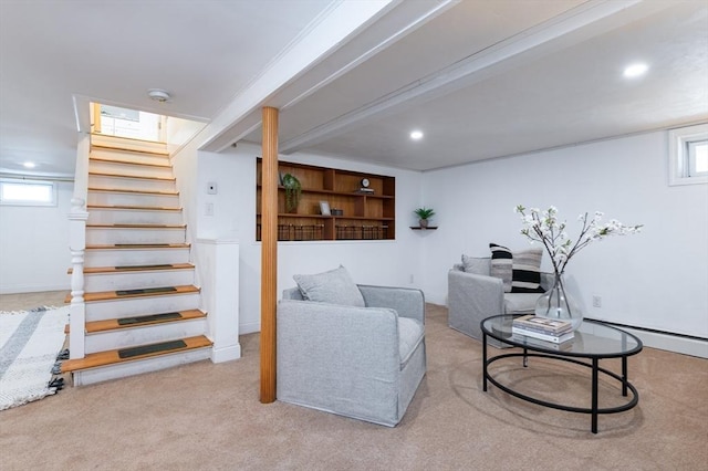 sitting room featuring light carpet and baseboard heating