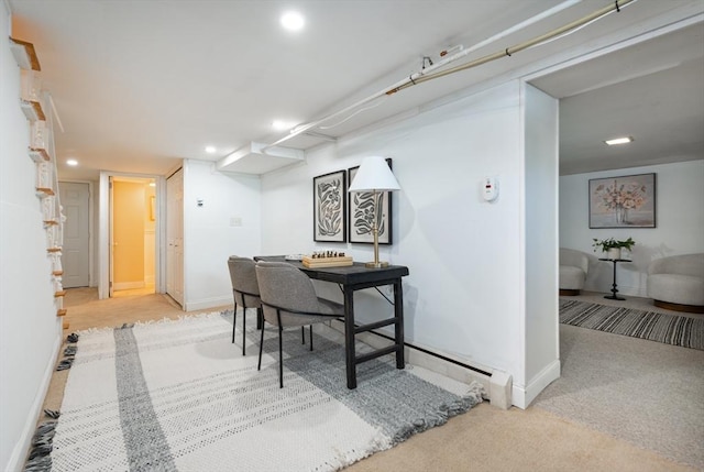 dining room featuring light colored carpet