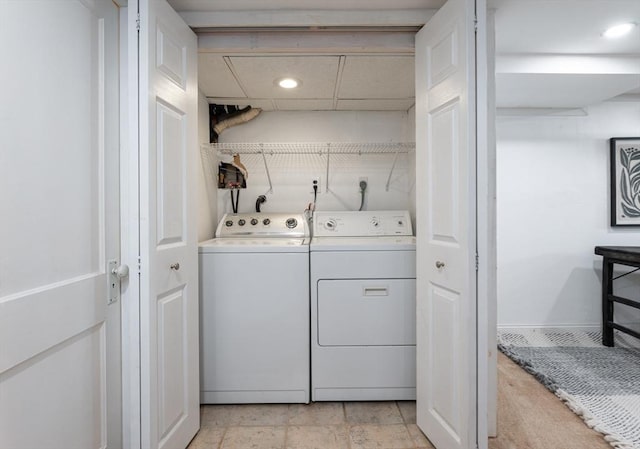 clothes washing area with independent washer and dryer