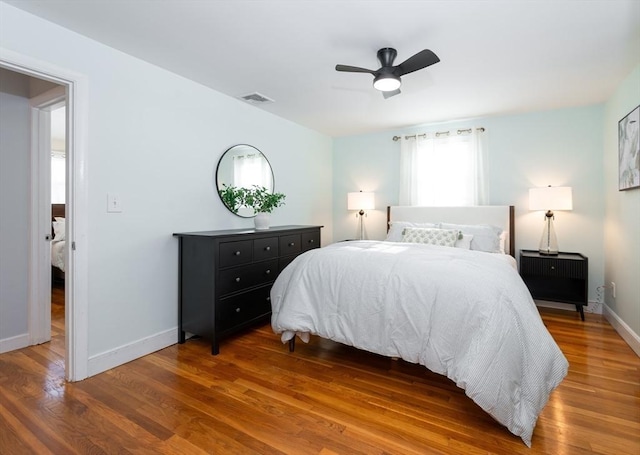 bedroom featuring hardwood / wood-style floors and ceiling fan