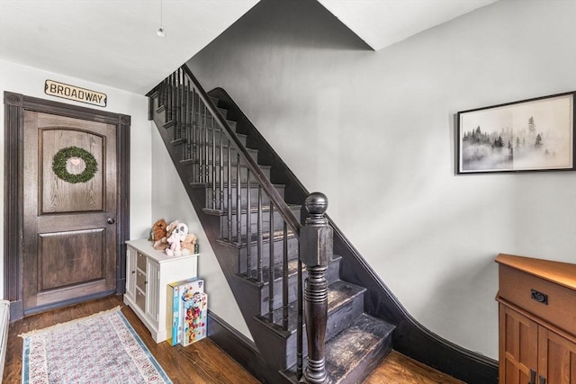 53 Avon St, Taunton, MA 02780 - staircase with wood finished floors and a baseboard heating unit