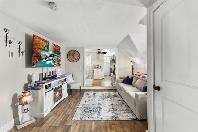 53 Avon St, Taunton, MA 02780 - living area with wood finished floors, a textured ceiling, ceiling fan, and baseboards