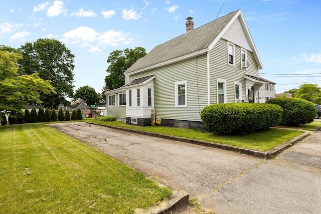 53 Avon St, Taunton, MA 02780 - view of side of home featuring a lawn, a chimney, and a shingled roof