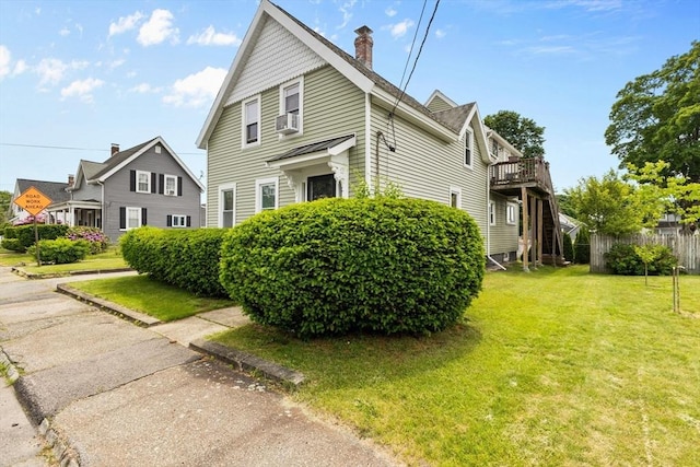 53 Avon St, Taunton, MA 02780 - view of side of property featuring a lawn, a chimney, cooling unit, and a deck