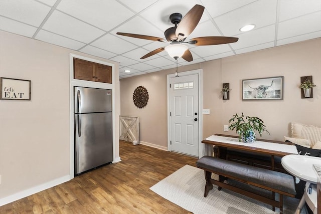 53 Avon St, Taunton, MA 02780 - dining area with baseboards, ceiling fan, light wood-style flooring, and a paneled ceiling
