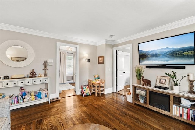 53 Avon St, Taunton, MA 02780 - living area featuring wood finished floors, baseboards, and crown molding
