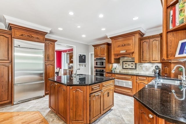225 Walker St, Seekonk, MA 02771 - kitchen with stainless steel appliances, a sink, a warming drawer, a center island, and light tile patterned floors