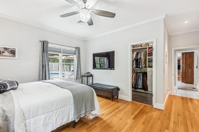 225 Walker St, Seekonk, MA 02771 - bedroom with crown molding, baseboards, a spacious closet, light wood finished floors, and a closet