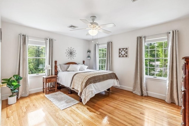 225 Walker St, Seekonk, MA 02771 - bedroom featuring multiple windows, light wood-type flooring, baseboards, and ceiling fan