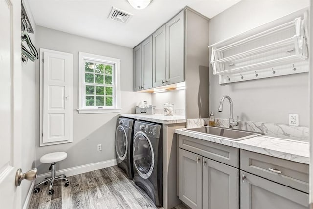 225 Walker St, Seekonk, MA 02771 - washroom featuring independent washer and dryer, cabinet space, wood finished floors, and baseboards