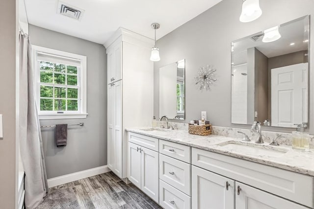 225 Walker St, Seekonk, MA 02771 - bathroom featuring wood finished floors, double vanity, and baseboards