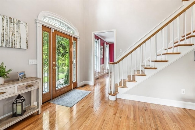 225 Walker St, Seekonk, MA 02771 - entryway with wood finished floors, stairway, baseboards, and a high ceiling