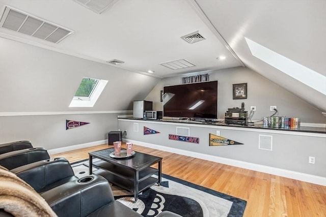 225 Walker St, Seekonk, MA 02771 - living room with a skylight, wood finished floors, lofted ceiling, baseboards, and recessed lighting