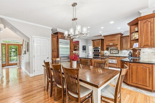 225 Walker St, Seekonk, MA 02771 - dining area with light wood-style floors, ornamental molding, recessed lighting, a chandelier, and baseboards