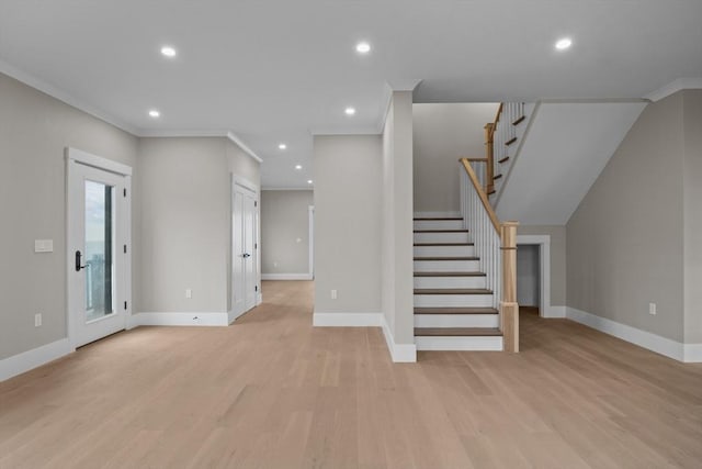 unfurnished living room with light hardwood / wood-style floors and ornamental molding