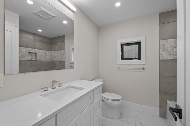 bathroom featuring vanity and toilet