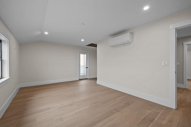 empty room with light wood-type flooring and a wealth of natural light