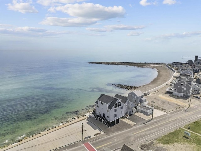 bird's eye view with a water view and a beach view