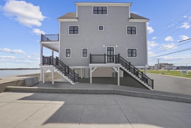 rear view of house with a water view