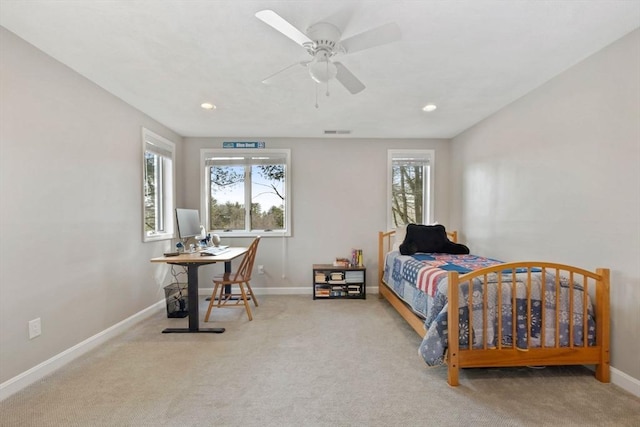 bedroom with carpet flooring, multiple windows, and baseboards