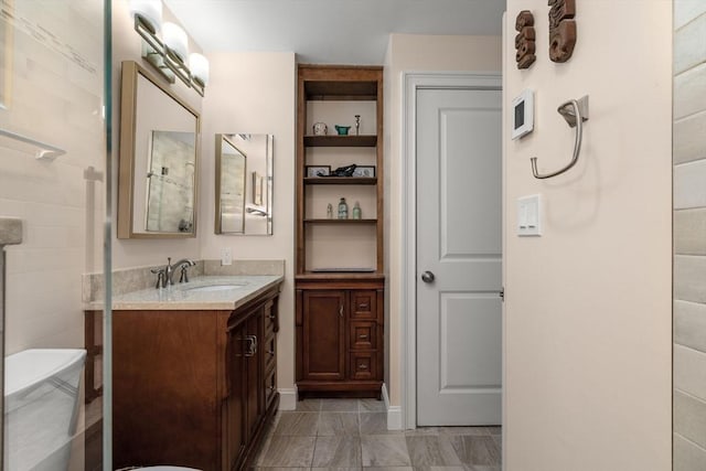 full bathroom with vanity and tile patterned floors
