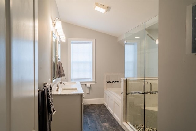 41 Washington Unit C, Newburyport, MA 01950 - bathroom with vaulted ceiling, a bath, vanity, a stall shower, and baseboards