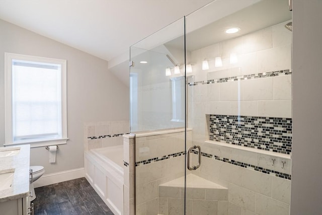 41 Washington Unit C, Newburyport, MA 01950 - full bathroom with a garden tub, a stall shower, vanity, toilet, and vaulted ceiling