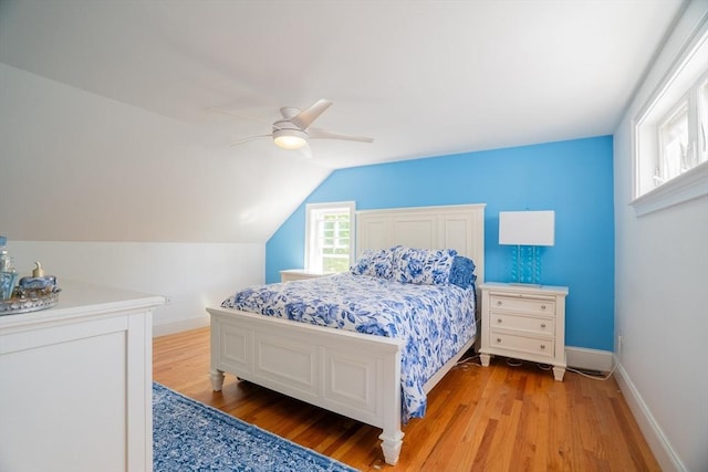 41 Washington Unit C, Newburyport, MA 01950 - bedroom with light wood-style flooring, baseboards, ceiling fan, and lofted ceiling