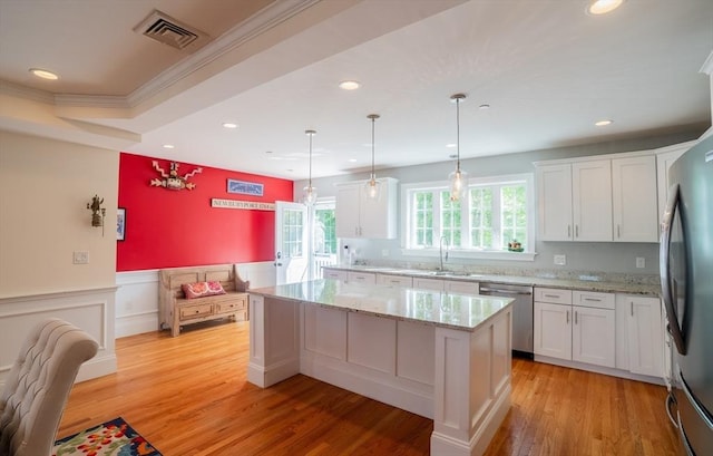 41 Washington Unit C, Newburyport, MA 01950 - kitchen featuring stainless steel appliances, recessed lighting, white cabinetry, a kitchen island, and a sink