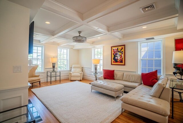 41 Washington Unit C, Newburyport, MA 01950 - living area with ceiling fan, beamed ceiling, plenty of natural light, wood finished floors, and coffered ceiling