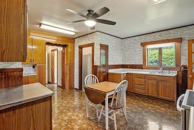 128 Arthur Ave, Athol, MA 01331 - kitchen featuring a sink, stove, brown cabinets, ceiling fan, and light countertops