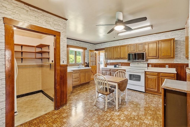 128 Arthur Ave, Athol, MA 01331 - kitchen with white electric range oven, stainless steel microwave, light countertops, ceiling fan, and a sink