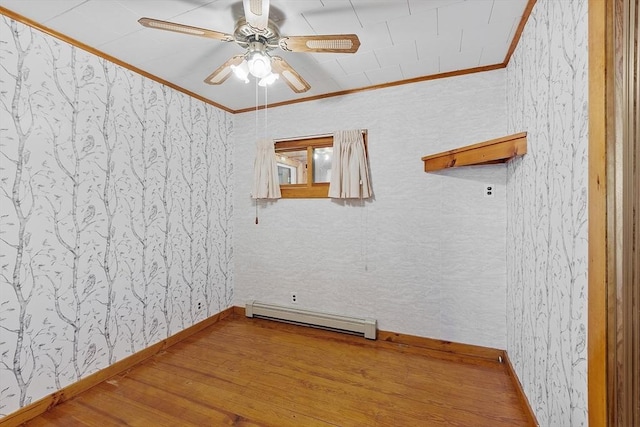 128 Arthur Ave, Athol, MA 01331 - unfurnished room featuring a baseboard heating unit, ornamental molding, wood finished floors, a ceiling fan, and baseboards